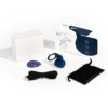 Fin by Dame Navy with charging cord, sticker and travel case on white table