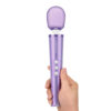 woman holding the violet Le Wand Petite