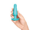 woman holding b-vibe anal training kit small plug for size