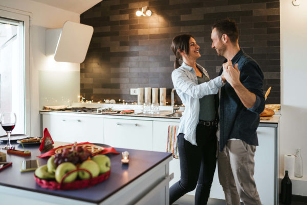 couple dancing in the kitchen